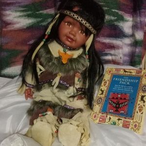 Indian doll with book